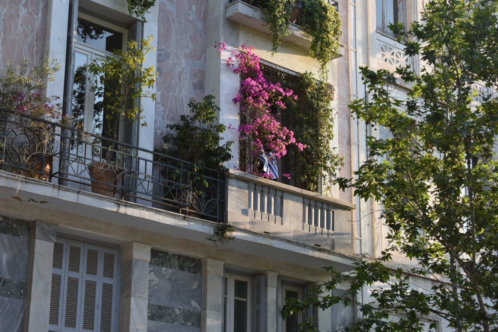 Apartment balcony with bright pink bouganvillea flowers