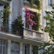Apartment balcony with bright pink bouganvillea flowers