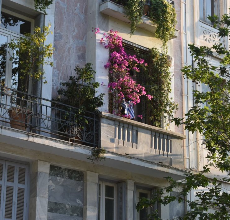 Apartment balcony with bright pink bouganvillea flowers