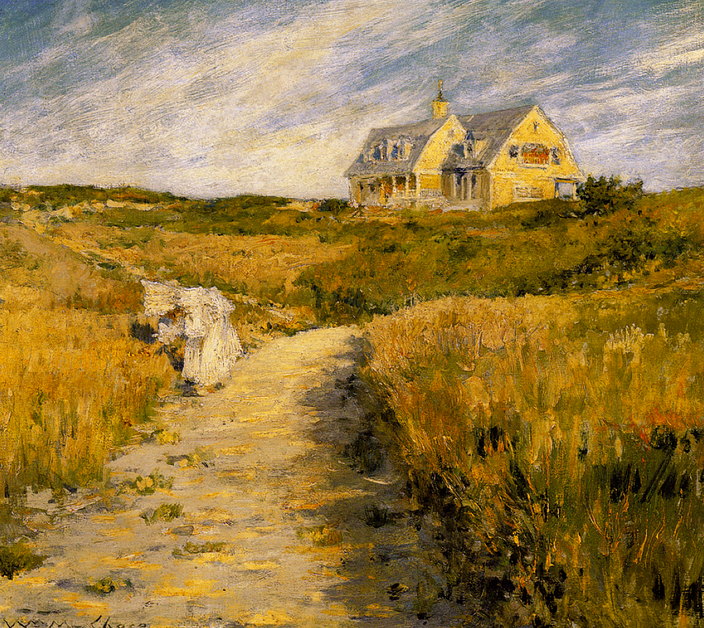 A yellow house in the background on a short hill, surrounded by brown grass