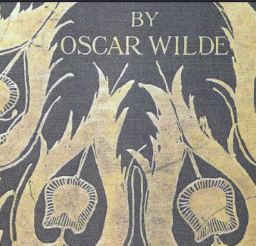 Photo scan of the cover of Salomé by Oscar Wilde, illustrated with gold peacock feathers