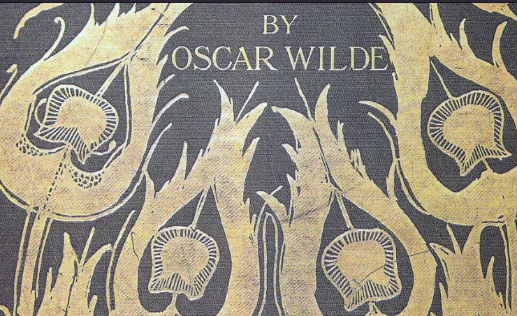 Photo scan of the cover of Salomé by Oscar Wilde, illustrated with gold peacock feathers