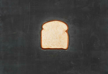 Pop art painting of a single slice of American white bread in the center of a charcoal grey canvas
