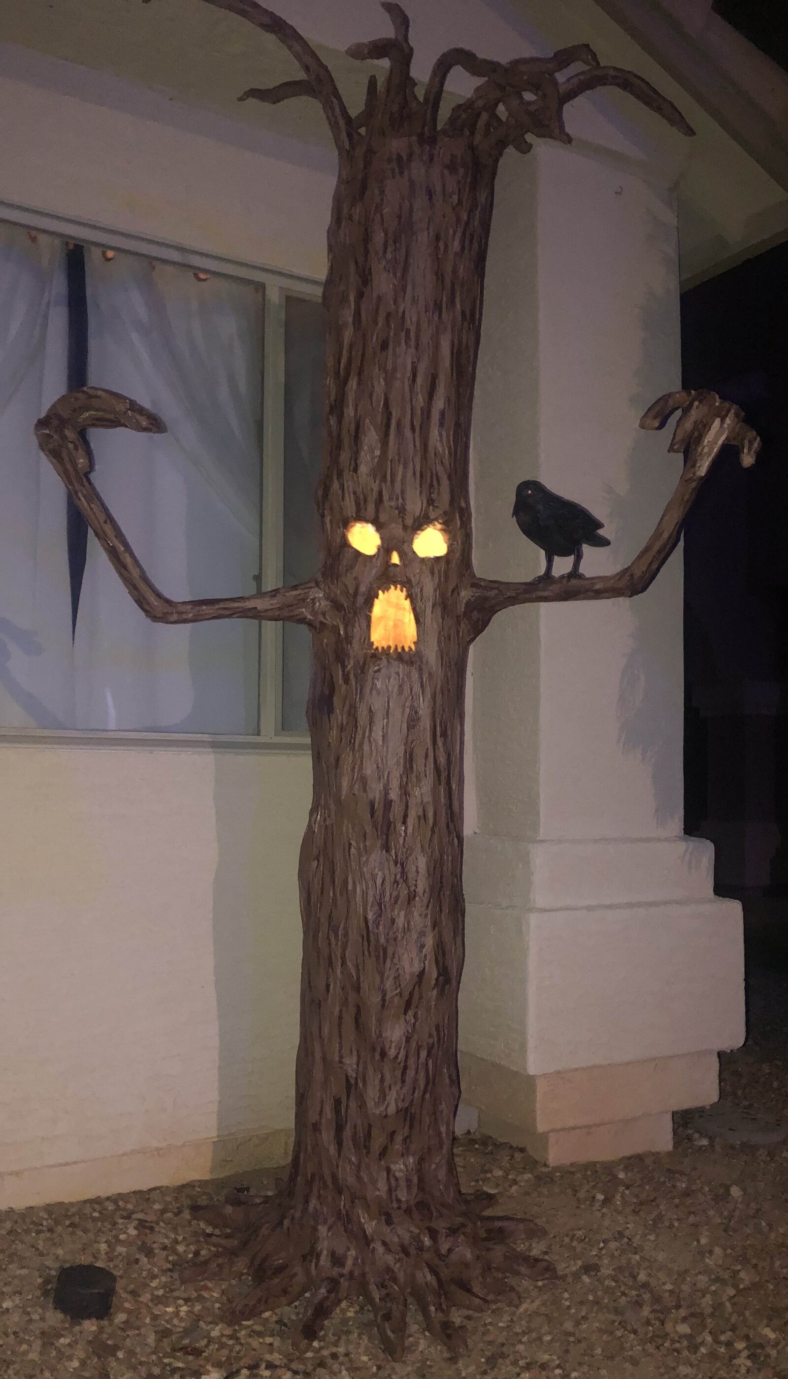 Haunted tree Halloween prop with glowing mouth and eyes